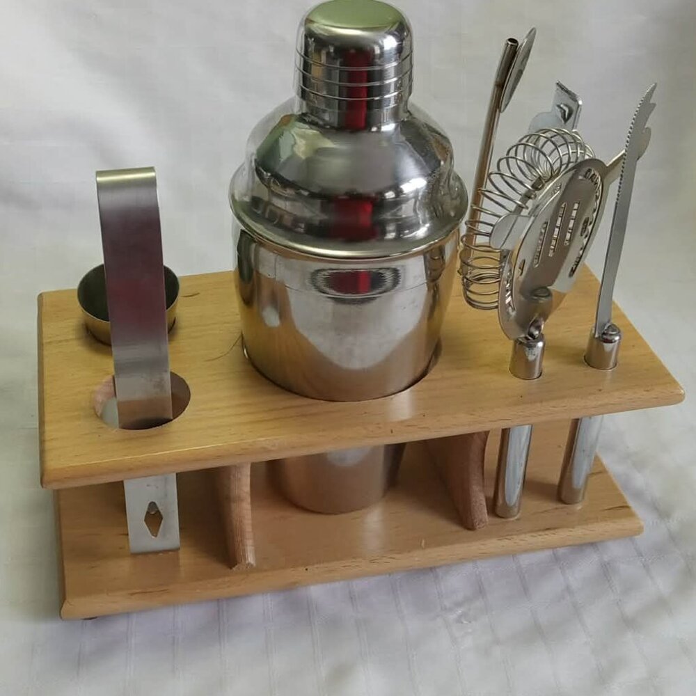 Vintage set bar accessories and stainless steel cocktail shaker wooden display